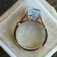 an engagement ring sitting on top of a napkin