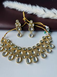 Stunning necklace set for this festive season , brides or bridal party ! Very beautiful set . Gold Kundan Choker Necklace, Festive Gold Plated Kundan Choker Necklace, Festive Gold-plated Kundan Choker Necklace, Festive Gold-plated Kundan Necklace, Kundan Choker Necklace For Celebration, Festive Silver Kundan Necklace Gold Plated, Silver Gold-plated Kundan Necklace For Festive Occasions, Kundan Choker Jewelry Sets For Celebration, Indian Bridal Necklace