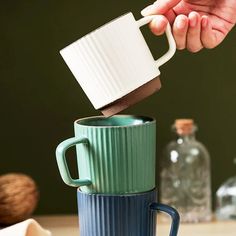 Transport yourself to a bygone era of timeless elegance with our enchanting minimal retro mugs. Crafted to perfection, these mugs radiate an air of nostalgia with their classic lines and vertical ribbed sides, reminiscent of a simpler time. Designed to infuse your daily coffee or tea ritual with a dash of vintage charm, they stand as a testament to the enduring allure of retro aesthetics. Embrace the warmth of tradition and elevate your beverage experience to new heights with every sip from our captivating vintage mugs. Key Features: Timeless Design: Revel in the classic appeal of these mugs, featuring those nostalgic vertical ribbed sides that are as stylish today as they were yesterday. Vibrant Color Options: Choose between two delightful colors, green and blue, to suit your mood and sty Retro Mugs, Vintage Mugs, Blue Cups, Tea Ritual, Vintage Elegance, Bygone Era, Colors Green, Tea Rituals, Vintage Coffee