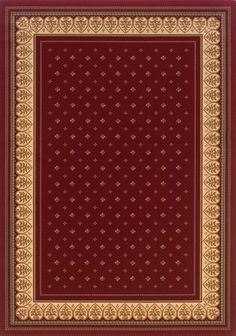 a red area rug with gold border