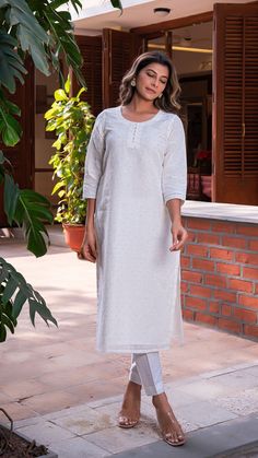 Comfortable kurta made in pure linen fabric with hand embroidered tikkis. Matching straight narrow pants. An absolute all-season essential - cool in summer and warm in winter. Features a round neck. Quarter sleeves. Fully lined kurta. Kurta Fabric : Linen. Pants Fabric : Cotton Linen. Model height is 5.6” and is wearing a size S. Wash Care : Dry Clean Only. Linen Straight Kurta With Resham Embroidery, Straight Linen Kurta With Resham Embroidery, Linen Kurta With Resham Embroidery, Traditional Linen Kurta With Resham Embroidery, Festive Embroidered Linen Kurta, Spring Festive Linen Kurta, Fitted Kurta With Chikankari Embroidery And Straight Pants, Fitted Linen Kurta With Chikankari Embroidery, Embroidered Linen Kurta