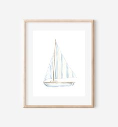 a watercolor painting of a sailboat with white sails on a white background in a wooden frame