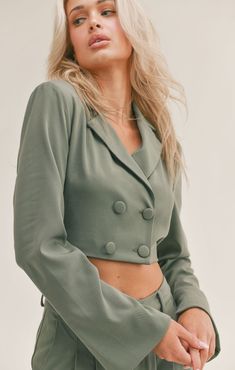 Our Cool Classic Crop Blazer will have everyone asking where your top is from. It has a double breasted button closure and a layered open back. Pair with the matching Cool Classic Pants for a complete look. Layered Back With Tie Detailing 95% POLYESTER 5% SPANDEX LE1501 Spring Months, Classic Trousers, Crop Blazer, Classic Pants, Classic Blazer, Cropped Blazer, Knit Sweatshirt, Effortless Chic, Mens Activewear