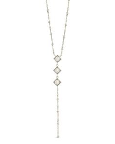 Introducing the Reine Lariat Necklace, a luxurious piece crafted for the sophisticated individual. This elegant necklace features a delicate beaded chain adorned with lustrous pearls, exuding an air of exclusivity and refinement. Elevate any outfit with the timeless style and grace of the Reine Lariat Necklace. Material: 14K gold or rhodium plated brass, freshwater pearls Features: Measures 16" with 2" extender, 3.75" drop, 0.35" pendants, 5mm pearls, 2mm chain, Lead & Nickel free, lobster clasp Elegant Pearl Lariat Dangle Necklace, Elegant Pearl Dangle Lariat Necklace, Elegant Pearl Lariat Necklace With Dangle, Elegant Pearl Charm Dangle Lariat Necklace, Elegant Pearl Charm Lariat Necklace With Dangle, Elegant Lariat Necklace With Pearl Charm Dangle, Elegant Lariat Chain Necklace For Party, White Lariat Backdrop Necklace With Pearl Charm, Elegant Long White Chain Necklace