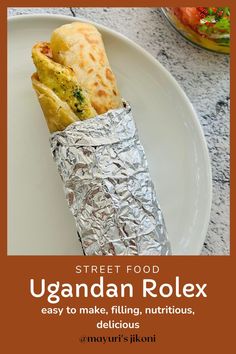 a plate with some food wrapped in foil on it and the text street food ugandar rolex easy to make, filling, nutritious, delicious