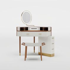 a white desk with a mirror and stool in front of it on a plain background