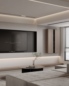 a large flat screen tv mounted to the side of a wall in a living room