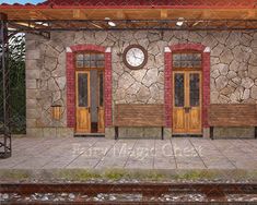 a train station with two benches and a clock on the wall next to each other