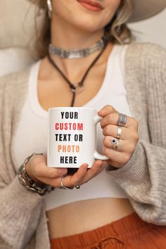 a woman wearing a hat holding a coffee mug with the text your custom text or photo here on it