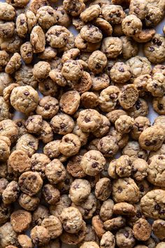 chocolate chip cookies are piled on top of each other