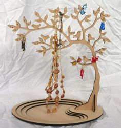 a wooden tree with beads hanging from it's branches