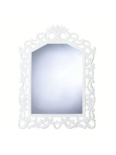 a white wall mirror with an ornate design on the front and back side, against a white background