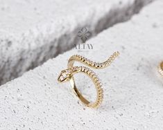 ABOUT PRODUCT This 14k Gold Snake Ring is suitable gift for girlfriend, mom and her. You can even buy as a birthday gift for your friends or anniversary gifts, If you want to add a special note we can write for you and put to inside of package. We manufacture our jewelry pieces with carefully and after production we double checking in quality control department. Our main idea is keep our items for daily wearing especially for minimalist jewelry pieces. Cute Snake animal ring. Great design tiny g Adjustable Jewelry With Pave Setting As Gift, Adjustable Pave Setting Jewelry As Gift, Elegant Cubic Zirconia Snake Ring Gift, Gold Snake Ring With Diamond Accents For Gift, Gold Snake Ring With Diamond Accents As Gift, Fine Jewelry Cubic Zirconia Snake Ring Gift, White Gold Snake Ring With Diamond Accents For Gift, White Gold Snake Ring With Diamond Accents As Gift, Luxury Snake Ring With Diamond Accents As Gift