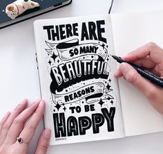 there are so many beautiful reasons to be happy written in a book with black ink