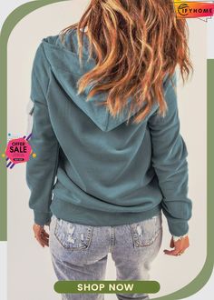 the back of a woman's hoodie is shown