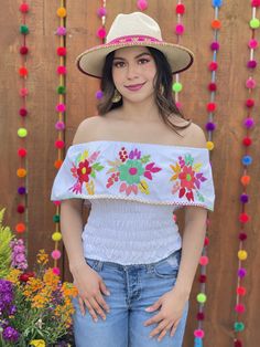 This Beautiful Off the Shoulder Crop Top is the perfect Top for a fun day out. It's made out of cotton, has an elastic waist and is full of vibrant hand embroidered florals. Please note: This blouse comes in one size which fits sizes Small and Medium. This blouse is hand embroidered and the embroidered colors vary on each blouse making each blouse one of a kind. You may purchase the jewelry in a variety of colors and styles found in another post. Blouse Crop Top, Blouse Crop, Mexican Fashion, Mexican Blouse, Embroidered Crop Tops, Off The Shoulder Blouse, Plunge Dress, Fashion Blouse, Shoulder Crop Top