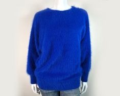 "Fuzzy 80% Angora Vintage VENESHA Pullover Sweater. It is Cobalt Blue with Long, Dolman Sleeves, and a Jewel Neck. It features a Back Button Closure. Size M. It has been professionally cleaned--chemical free--and is ready to wear! Please use provided measurements rather than tag size. We measure garments unstretched. It's a good idea to double-check measurements! Most sweaters stretch quite a bit, and size and fit vary from brand-to-brand, but if you have any doubts about the fit, please check t Blue Crew Neck Sweater For Work, Angora Sweater, Long Sleeve Pullover Sweater, Pullover Sweater Women, Jewel Neck, Chemical Free, Dolman Sleeve, Women Pullover, Long Sleeve Pullover