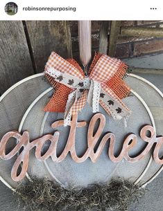 an orange and white pumpkin with the word gather on it