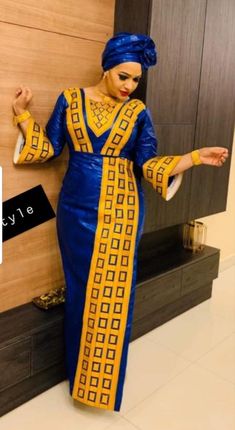 Description: This magnificent custom African dress is perfect for any occasion you want to look your best. Important Note: For broderie mix with bazin and garniture mix clothes only: Depending on the availability of the( fabric) / Garnitures (TRIMS) may be different than the one in the pictured. However, the dress will be sewn exactly in the style and colors shown. You can always request to see the fabrics or trims before we start by sending us a message along with your order. PROCESSING: We usu Gold Long Sleeve Ceremonial Dress, Ceremonial Gold Fitted Dress, Blue Party Dress With Gold Embroidery, Gold Fitted Ceremonial Dress, Gold Fitted Dress For Ceremonial Occasions, Elegant Blue Ceremonial Dress, Fitted Long Sleeve Gown For Ceremonial Occasions, Gold African Dress, Linen Tunics For Women