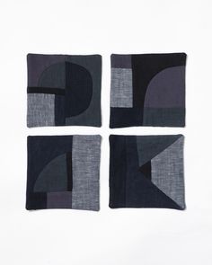 four square pieces of fabric with different shapes