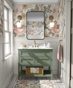 a bathroom with floral wallpaper and green vanity, gold faucet sink and mirror