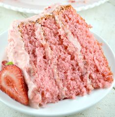 a slice of strawberry cake on a white plate