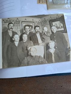 an old black and white photo of a family