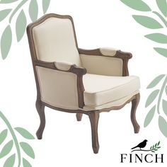 a white chair sitting in front of a green leafy background with the words finch furniture