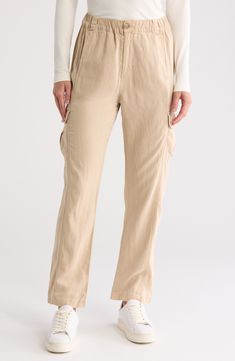 Comfy cargo pants for kicked-back days are cut from linen-kissed twill with an elastic waistband and roomy pockets lending a cool utility vibe. Zip fly with button closure; elastic waist Front and back welt pockets; cargo patch pockets 49% Tencel® lyocell, 28% linen, 21% cotton, 2% elastane Tencel lyocell is a more-sustainably produced fiber made with closed-loop processing Machine wash, tumble dry Made in Turkey Linen Cargo Pants With Elastic Waistband And Straight Leg, Beige Linen Cargo Pants For Spring, Casual Linen Parachute Pants With Cargo Pockets, Spring Linen Parachute Pants With Cargo Pockets, Casual Linen Parachute Pants With Straight Leg, Casual Linen Parachute Pants With Pockets, Casual Linen Cargo Bottoms, Relaxed Fit Linen Cargo Pants With Straight Leg, Casual Linen Cargo Pants With Loose Fit Hips