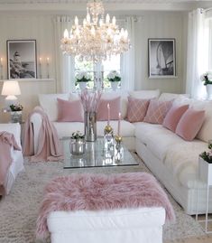 a living room filled with furniture and a chandelier