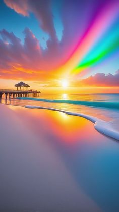 the sun is setting over an ocean with a pier in the distance and rainbow colored clouds