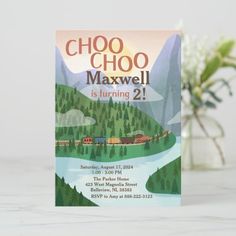 a card with the words choo choo maxwell is turning 2 on it next to a potted plant