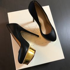 Stunning Charlotte Olympia Classic Black Pump In Size 35! Brand New With No Scratches Or Stains On It!!! Gold Platform Looks Fabulous With Dress Or Jeans And It’s Super Comfy!!! Comes With Shoes Box And Dust Bag :) 100% Authentic! It’s A Gift No Receipt! Chic Evening Heels With Rubber Heel Cap, Black Almond Toe Heels For Gala, Leather Heels With Rubber Heel Cap For Party, Black Court Shoes With Rubber Heel Cap For Evening, Chic Evening Court Shoes With Rubber Heel Cap, Evening Black Court Shoes With Rubber Heel Cap, Chic Evening Court Shoes, Black Almond Toe Heels For Galas, Black Sculpted Heel For Galas