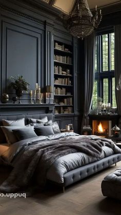 a large bed sitting in a bedroom next to a window filled with lots of books