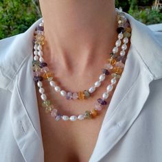 Pearl mixed stone layered necklace. Chunky statement natural gemstone beaded necklace for women. Large white colorful gold handmade necklace with gemstone. Bohemian bright necklace in gold color are suitable for an casual look, evening look and for a holiday. These necklace will be a good Christmas, anniversary, wedding or birthday gift for women, mom, wife, girlfriend, sister or daughter. Women's necklace with natural stone. It emphasizes the beauty of your neck and adds charm to your look. FAS Multi-strand Pearl Necklace With Natural Stones For Gifts, Gift Multi-strand Pearl Necklace With Natural Stones, Multi-strand Necklaces With Natural Stones For Gift, Multi-strand Natural Stones Necklace For Gift, Multi-strand Natural Stones Necklaces As Gift, Multi-strand Natural Stones Necklace As A Gift, Double Strand Pearl Necklace With Gemstone Beads, Double Strand Necklace With Natural Stones, White Double Strand Beaded Necklaces With Natural Stones