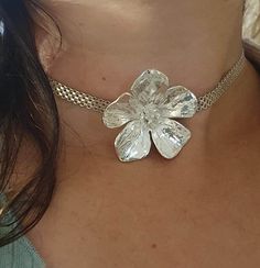 **FREE EXPRESS SHIPPING** Immerse yourself in the delicate beauty of nature with this exquisite sterling silver pendant, featuring a resplendent Buttercup flower Crafted with meticulous attention to detail, each petal of the Buttercup is intricately formed, capturing the essence of this charming bloom in its full glory. The pendant boasts a generous size, ensuring it becomes a captivating focal point of any ensemble Its lustrous silver surface gleams softly, casting a subtle sheen that enhances the intricate design. The Buttercup's gentle curves and delicate texture evoke a sense of grace and femininity, making it a perfect adornment for those who appreciate nature's elegance. Complementing this stunning pendant is a wide silver chain, meticulously crafted to provide both strength and beau Delicate Silver Flower Pendant Jewelry, Silver Delicate Flower Pendant Jewelry, Handmade Delicate Silver Jewelry, Delicate Handmade Silver Jewelry, Silver Flower Charm Jewelry, Delicate Silver Flower Jewelry, Silver Flower-shaped Sterling Silver Jewelry, Silver Hallmarked Flower Necklace, Unique Silver Flower-shaped Jewelry