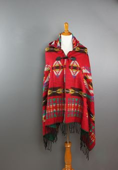 Wear it now for warmth, wear it later to a music fest. Even wear it and use it as a blanket for those spontaneous summer nights. This poncho will be your go to piece all year round! Details: 100% Acrylic Red or Navy One size fits most Red One-size Poncho Cape, Red One Size Cape Poncho, Red One-size Cape Poncho, Red One-size Cape Shawl, Casual One Size Shawl For Festivals, Red Shawl Poncho For Festival, Red Shawl Scarves For Fall, Red Shawl Outerwear For Winter, Red Cape Shawl For Winter