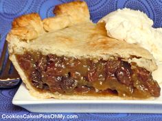 a piece of pie on a plate with ice cream