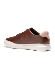 Crafted from quality leather and featuring hand-sewn crafted detailing, the Grand Pro Rally Lasercut Sneakers from Cole Haan are updated with antimicrobial properties. They include features that add to the cushioning and durability of the shoe, guaranteeing a great fit. | Cole Haan Men's Grand Pro Rally Lasercut Sneakers, 10M Outdoor Leather Sneakers With Perforations, Leather Sneakers With Perforations For Outdoor, Leather Sneakers With Perforated Toe Box For Outdoor, Cole Haan Men, Cole Haan, Hand Sewn, Hand Sewing, Sneakers, Leather