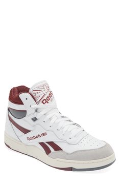 This street-ready mid-top sneaker has a basketball-inspired silhouette with a leather upper sporting suede details and an off-the-hardwood feel. Lace-up style Cushioned footbed Leather upper/synthetic lining/rubber sole Imported White Throwback High-top Sneakers With Rubber Sole, Throwback High-top Basketball Shoes With Gum Sole, Throwback Mid-top High-top Sneakers With Gum Sole, Throwback Mid-top Basketball Shoes With Boost Midsole, Throwback High-top Basketball Shoes With Boost Midsole, Throwback High-top Sneakers With Boost Midsole For Streetwear, Throwback High-top Basketball Shoes With White Sole, White High-top Throwback Skate Shoes, White Throwback High-top Skate Shoes