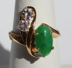 Beautiful jadeite jade and .43 ctw diamond 14k solid yellow gold ring. Jadeite jade measures: 11 x 6.3 x 2.6 mm (approx 1.5 carats). Gross weight: 6.35 grams. Ring Size: 6 1/2. Marked: 14k. Please see pictures of appraisal for details. BRIGHT AND LIVELY!! Jade Ring Engagement, Jade Engagement Ring, Simplistic Jewelry, Jade Wedding, Imperial Jade, Greenhouse Wedding, Future Engagement Rings, Jade Ring, Yellow Gold Ring