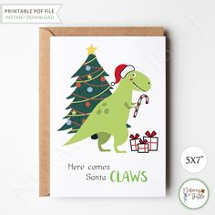 a christmas card with a dinosaur holding a candy cane in front of a christmas tree