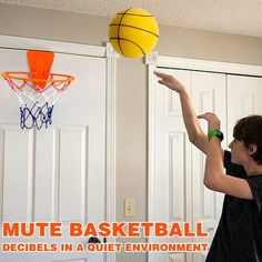 a young boy is playing with a basketball in his room, and the text reads mute basketball decibeils in a quiet environment