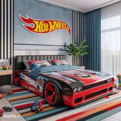 a bed room with a large bed and a hot wheels car on the wall above it