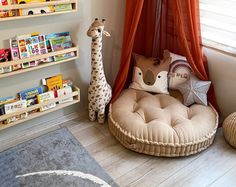 a child's room with bookshelves and toys