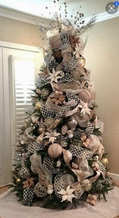 a decorated christmas tree in a living room