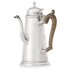 a silver coffee pot with a wooden handle