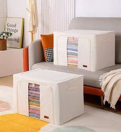 a living room filled with furniture covered in blankets and quilts on top of each other