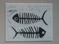 two fish are depicted in black and white ink on paper, each with a different pattern