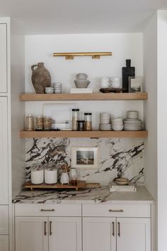 the instagram page shows an image of a kitchen with marble counter tops and shelves